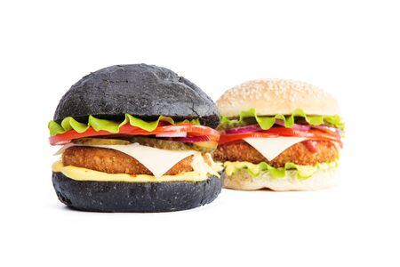 Delicious fast food. Two delicious burgers black and white, isolated on white backgroundの写真素材
