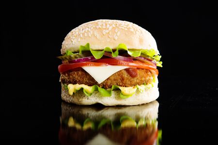 Delicious fast food. Burger on a wooden boardの写真素材