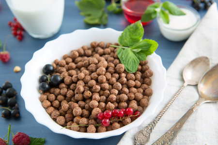 Sweet Cocoa Chocolate Sugar Cereal Puffs with Milk Healthy tasty breakfast chocolate balls with...