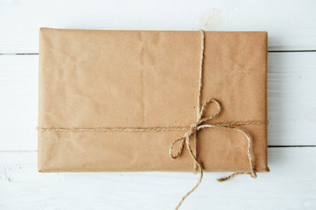 String tied in a bow on a brown recycled paper