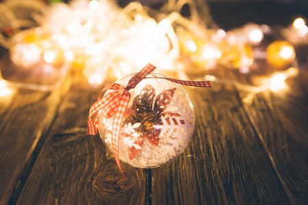 Christmas background. Christmas decoration on wooden table with christmas lights.の写真素材