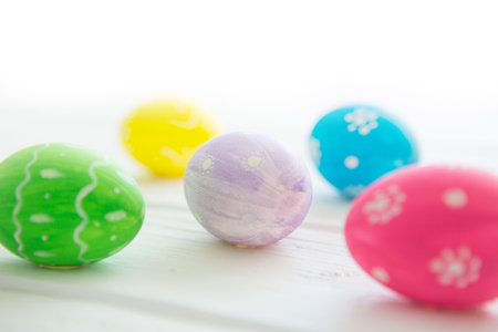 Easter eggs on a white wooden surface