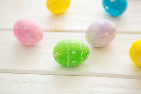 Easter eggs on a white wooden surface