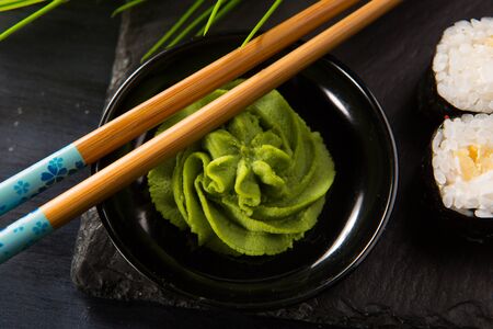Chinese sticks with wasabi on a black backgroundの写真素材
