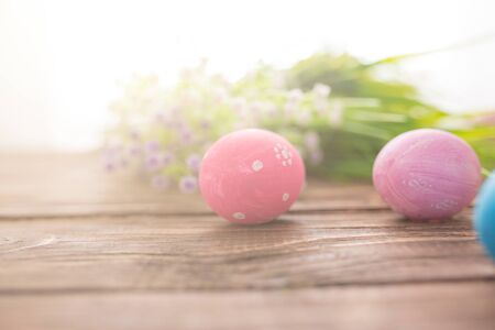 Easter eggs on a old wooden surfaceの写真素材