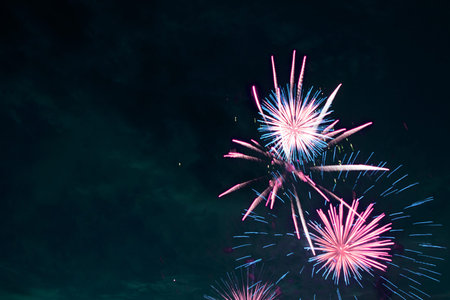 Fireworks display. 4th July fireworks. Fireworks display on dark sky background.