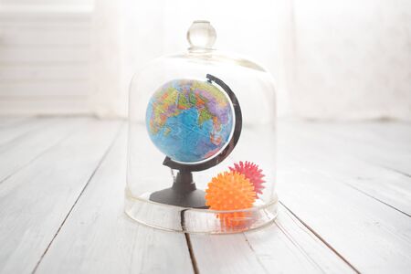 Globe under the glass dome. Pandemic quarantine and emergency COVID-19 . Virus Pandemic Protection Conceptの写真素材