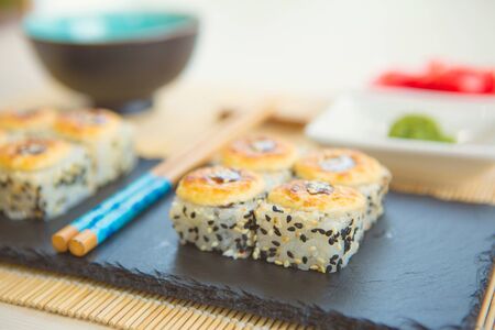 Hot fried Sushi Roll with salmon cheese. Sushi menu. Japanese food.の写真素材