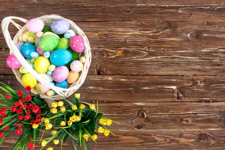 Easter eggs in nest on rustic wooden planks Copy space.の写真素材