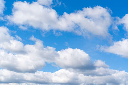 Blue sky with clouds. Typical midday skyの写真素材