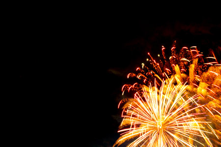 Beautiful fireworks for New Years, Independence Day or other holiday against the background of a dark sky.の写真素材