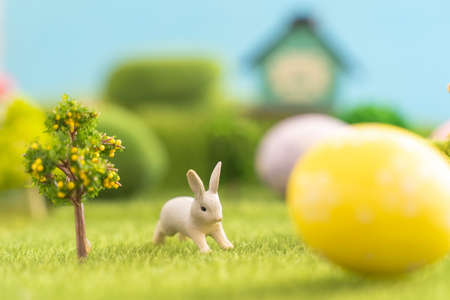 Easter egg outside in grass with evening sun from behindの写真素材