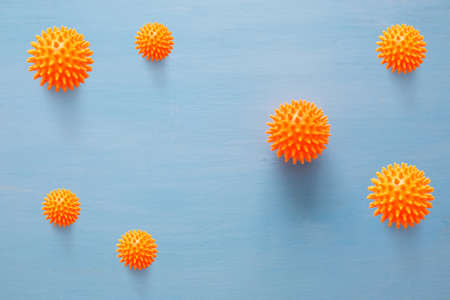 Abstract virus strain model of Coronavirus disease COVID-19 on blue wooden background with copy space.の写真素材