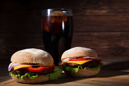 Homemade burger and Cold drink cola on wooden backgroundの写真素材