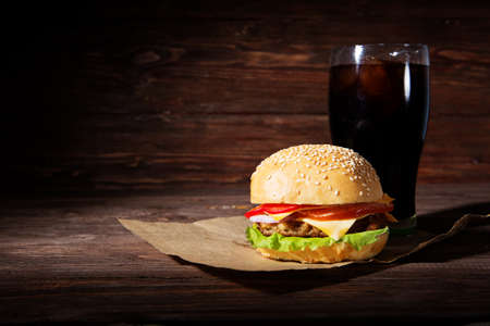 Homemade burger and Cold drink cola on wooden backgroundの写真素材