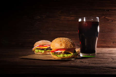 Homemade burger and Cold drink cola on wooden backgroundの写真素材