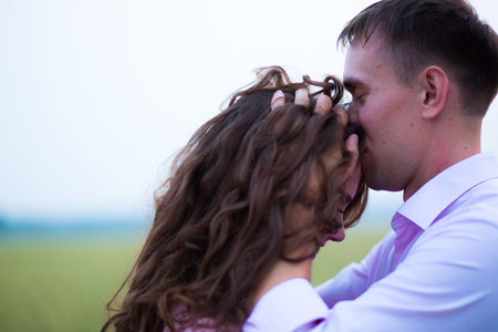 Bride and groom in field. Muslim marriage.