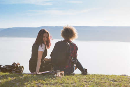 Two beautiful girls are traveling in the mountainsの写真素材