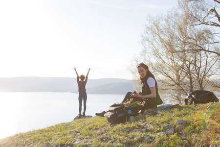 Two beautiful girls are traveling in the mountainsの写真素材