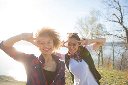Two beautiful girls are traveling in the mountainsの写真素材