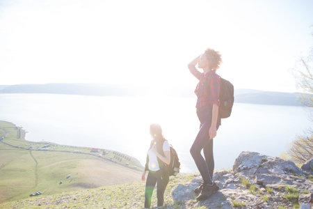 Two beautiful girls are traveling in the mountains Hiking in the mountainsの写真素材