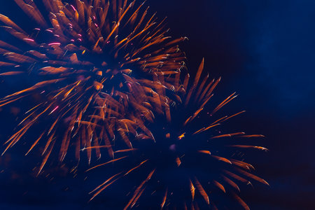 Brightly colorful fireworks and salute of various colors in the night sky. Independence Day, 4th of July, Fourth of July or New Year.の写真素材