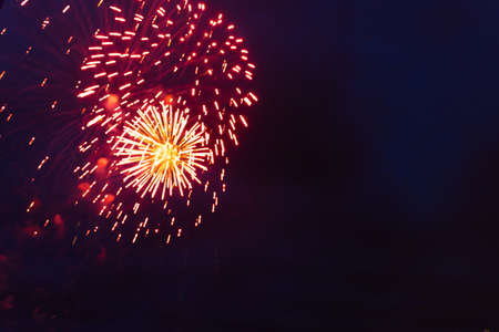 Brightly colorful fireworks and salute of various colors in the night sky. Independence Day, 4th of July, Fourth of July or New Year.の写真素材