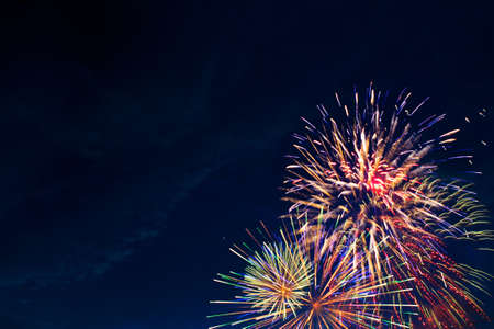 Fireworks on the background of the cloudy night sky. 4th of July - American Independence Day USAの写真素材