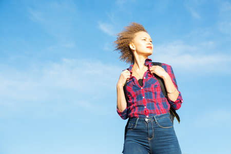 Woman hiker on a top of a mountainの写真素材