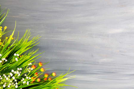 Bouquet of wildflowers on white vintage wooden board. Copy space.の写真素材