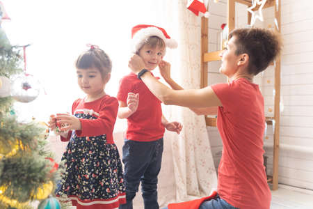 Family Opening Christmas Presents At Home Togetherの写真素材
