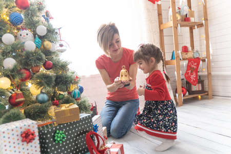 Family Opening Christmas Presents At Home Togetherの写真素材