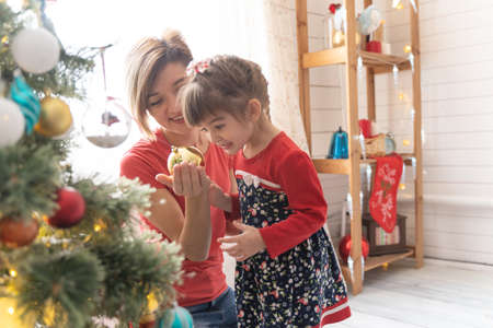 Family Opening Christmas Presents At Home Togetherの写真素材
