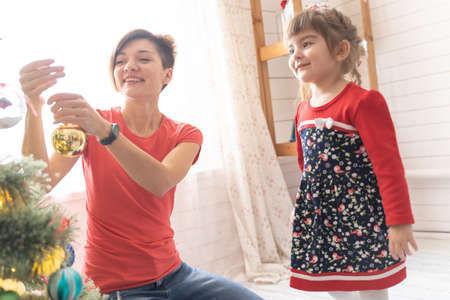 Family Opening Christmas Presents At Home Togetherの写真素材