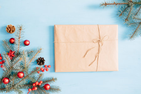 Christmas wooden background with fir tree and gift box. View with copy spaceの写真素材