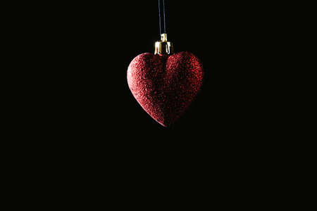 Christmas bauble over dark background. Low key photoの写真素材