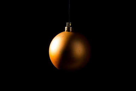 Christmas bauble over dark background. Low key photoの写真素材
