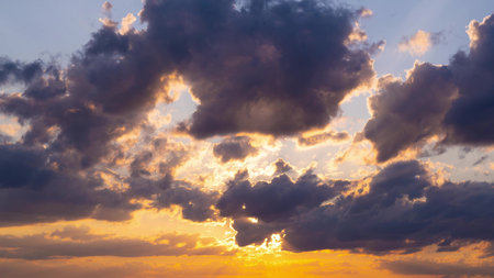 Clouds fly across the sky at sunset. Timelapse