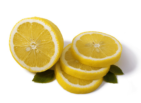 pieces of lemon and mint leaves isolated on whiteの写真素材