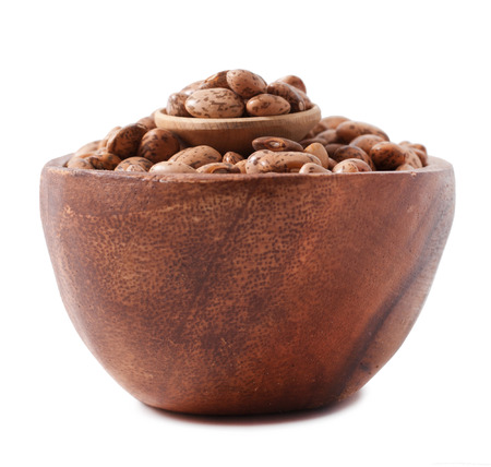 pinto beans on wood cup isolated on a white backgroundの写真素材