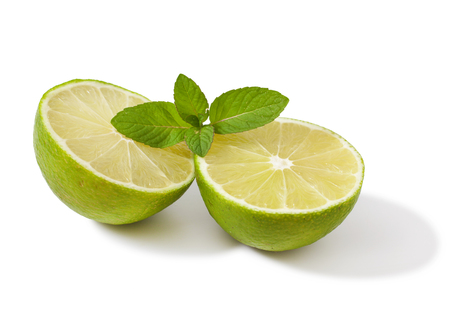 Fresh lime with mint isolated on a white backgroundの写真素材