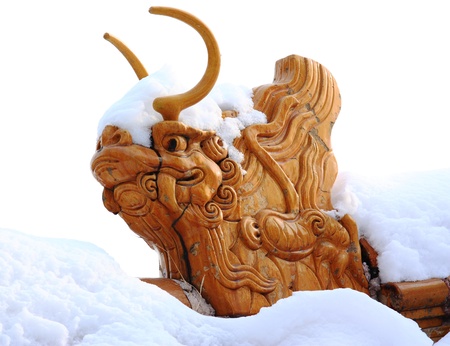 dragon with snow on roof,beijing,Chinaの写真素材