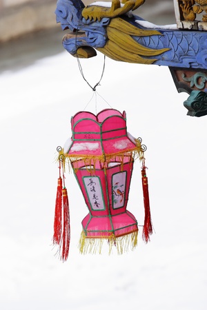 Chinese red lantern on snow.Image was taken in winter.の写真素材