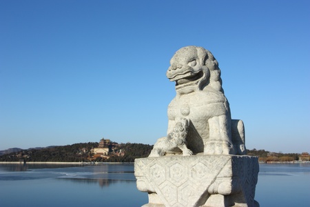 In the Summer Palace, these 544 carved white marble lions, in distinctive postures, sit at the column of the parapets on the 17-arch Bridge, which looks like a rainbow arching over the lake water.Beijing, Chinaのeditorial素材