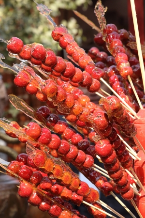 Sugarcoated haws on a stick の写真素材
