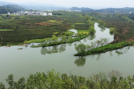 chinese village in spring with rape flowerの写真素材