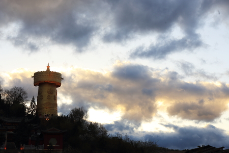 Buddhist temple with a tower during sunsetの写真素材