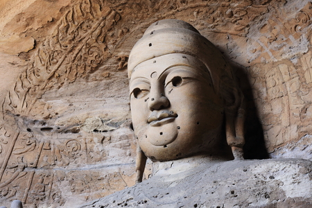 Buddha in the rock cave の写真素材