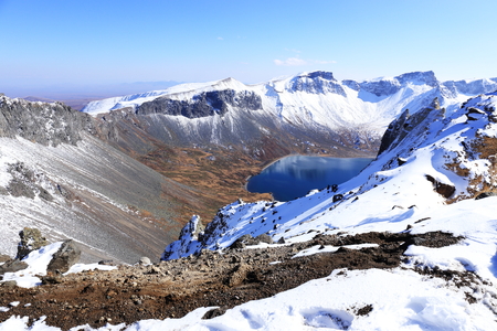 crater lake with snow in winterの写真素材