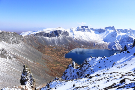 crater lake with snow in winterの写真素材